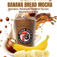 A Banana Bread Mocha featuring espresso blended with banana and hazelnut flavors, chocolate mocha sauce, and milk or breve for a rich, bakery-inspired taste.