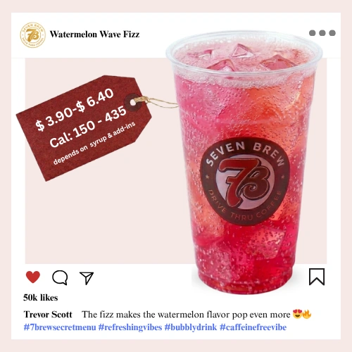 7 Brew Watermelon Wave Fizz Soda in a clear cup with vivid pink-red watermelon color — caffeine-free 7 Brew summer fizz drink